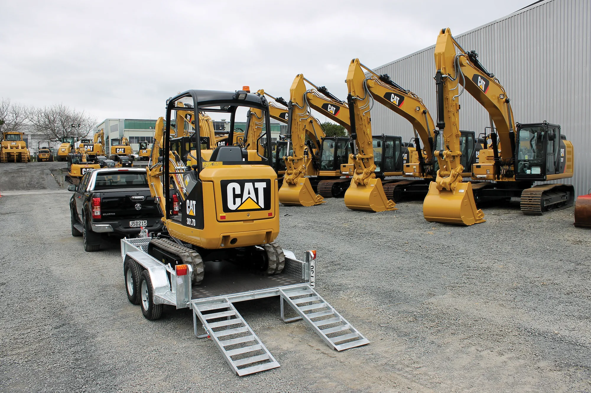 GT digger trailer towing a machine